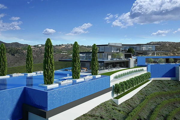 A house with a swimming pool on top of a hill.