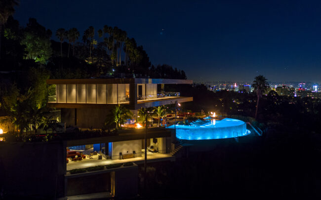 A night view of the pool and the house.