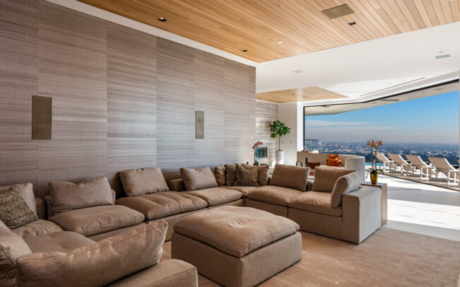 A living room with couches and a television.
