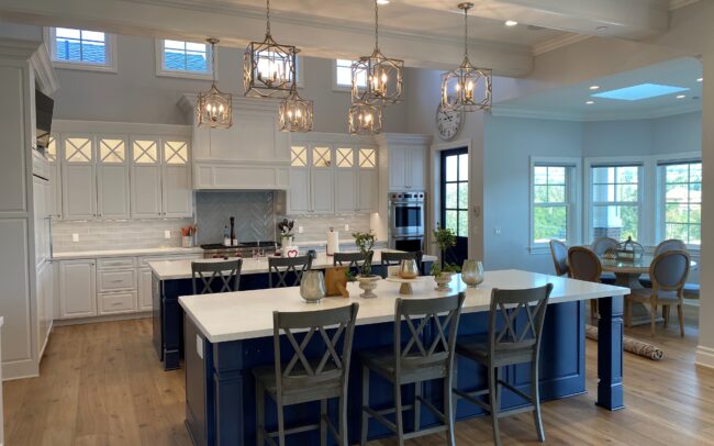 A large kitchen with two different colored cabinets