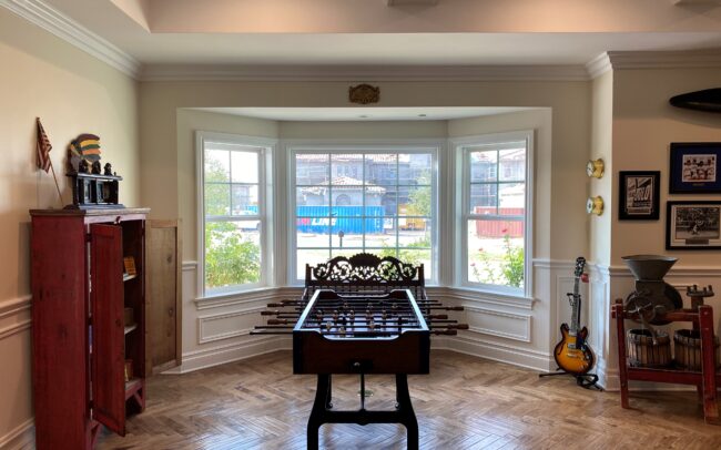 A room with a table and guitar in it