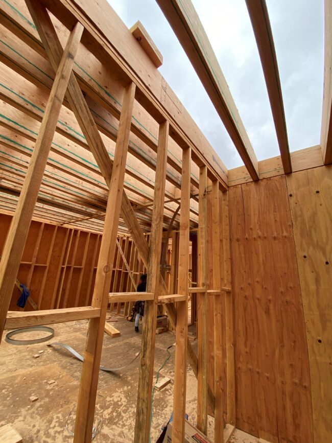 A room being built with wood framing and construction materials.