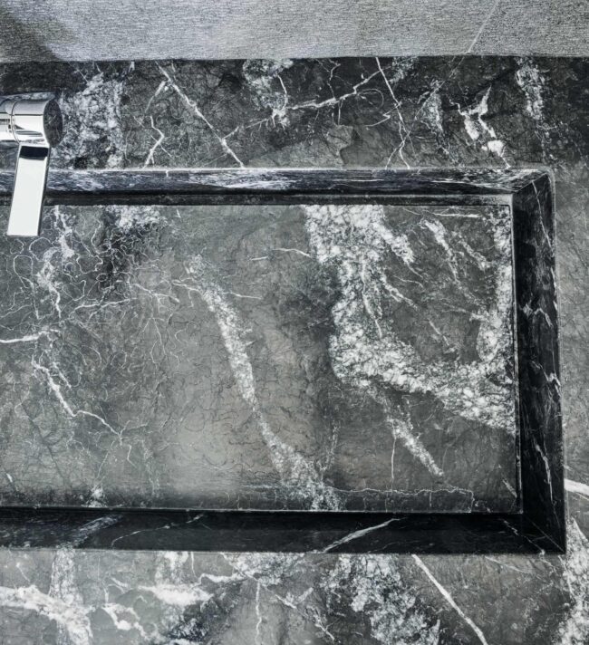 A black marble table with a glass top.