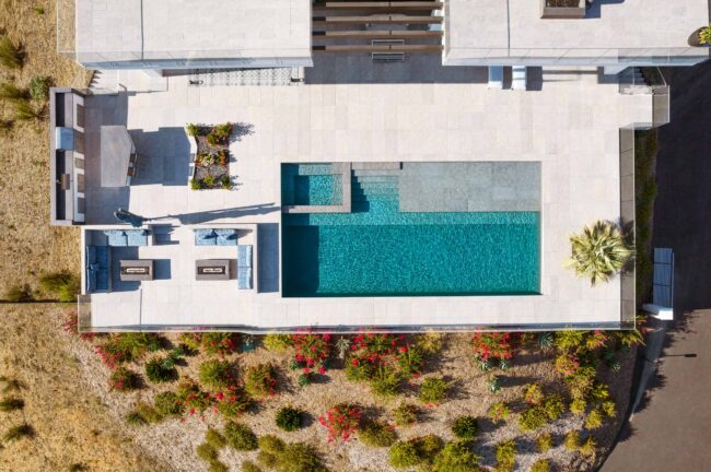 A aerial view of a pool and patio.