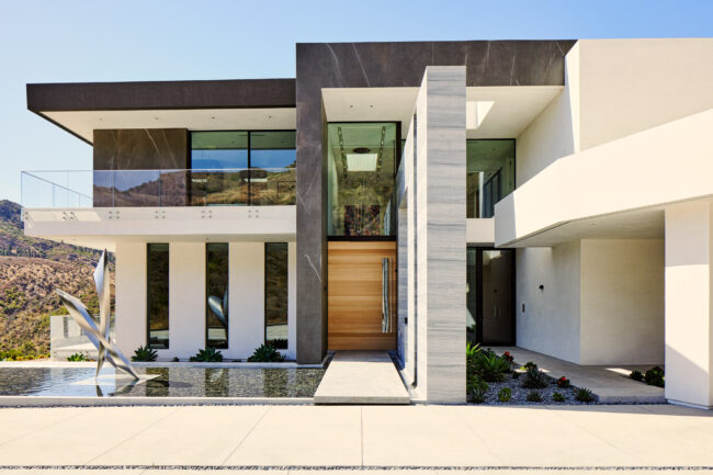 A modern house with a large entrance way.