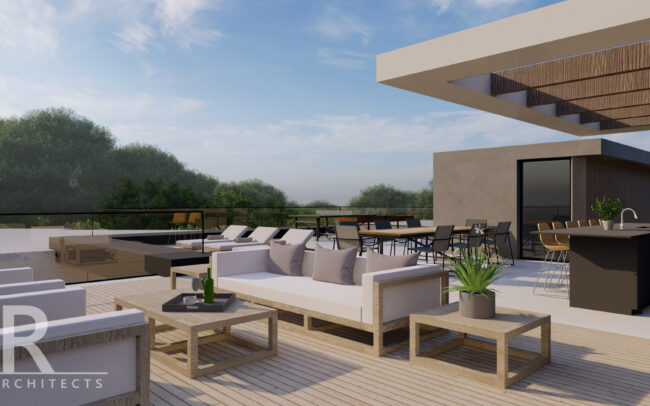 A large outdoor living room with furniture and tables.