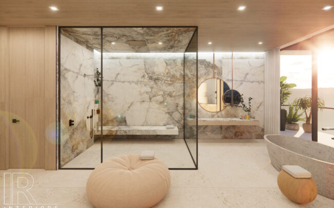 A room with marble walls and floors, a large mirror, a tub and a bean bag chair.