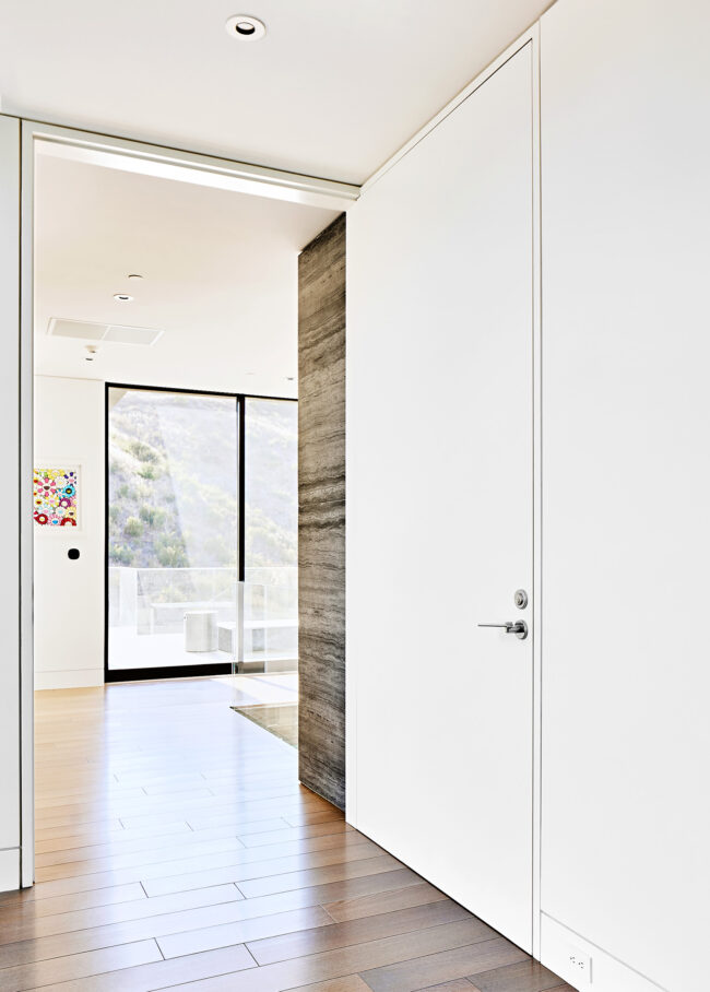 Floor to ceiling recessed door in residential design project