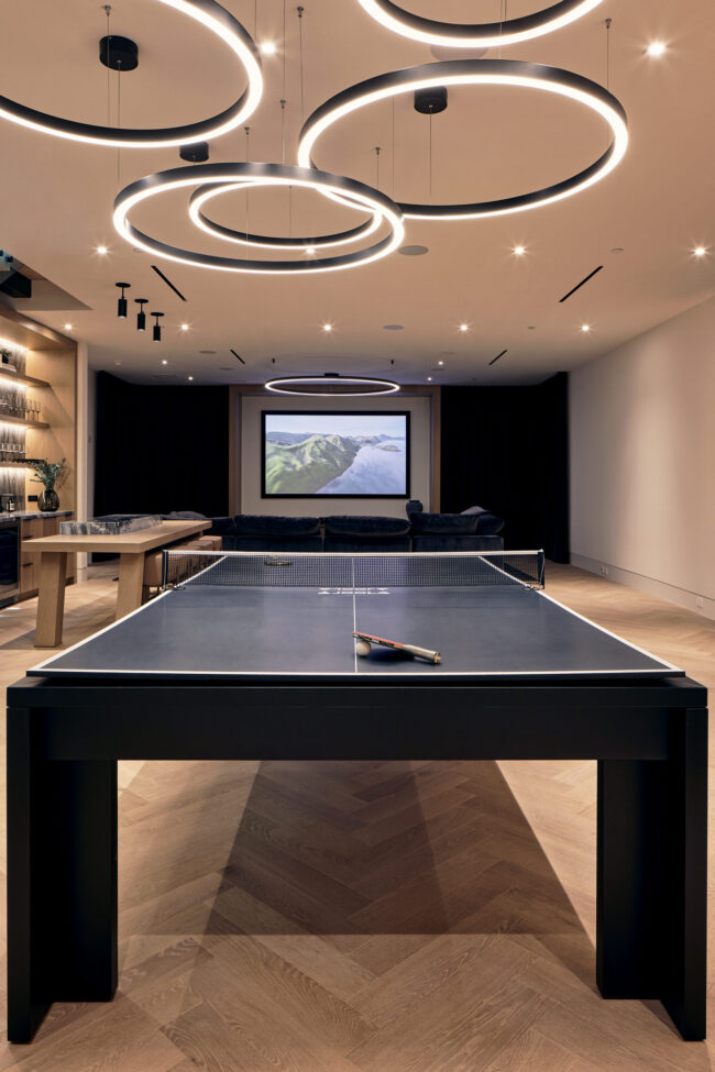 A ping pong table in the middle of a room.