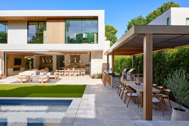 A large outdoor dining area with an open air pool.